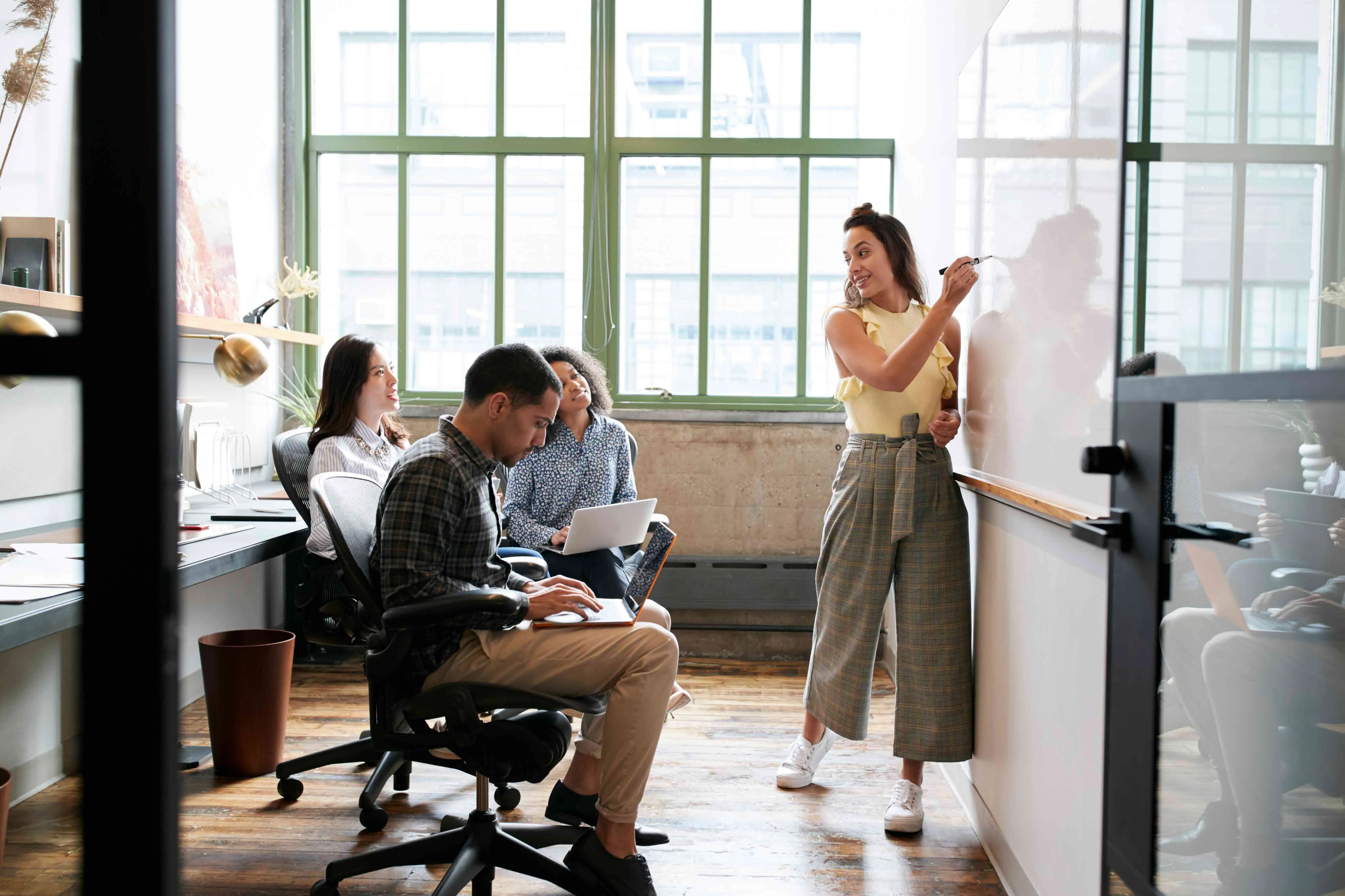 Startup founders reviewing funding documents and financial projections